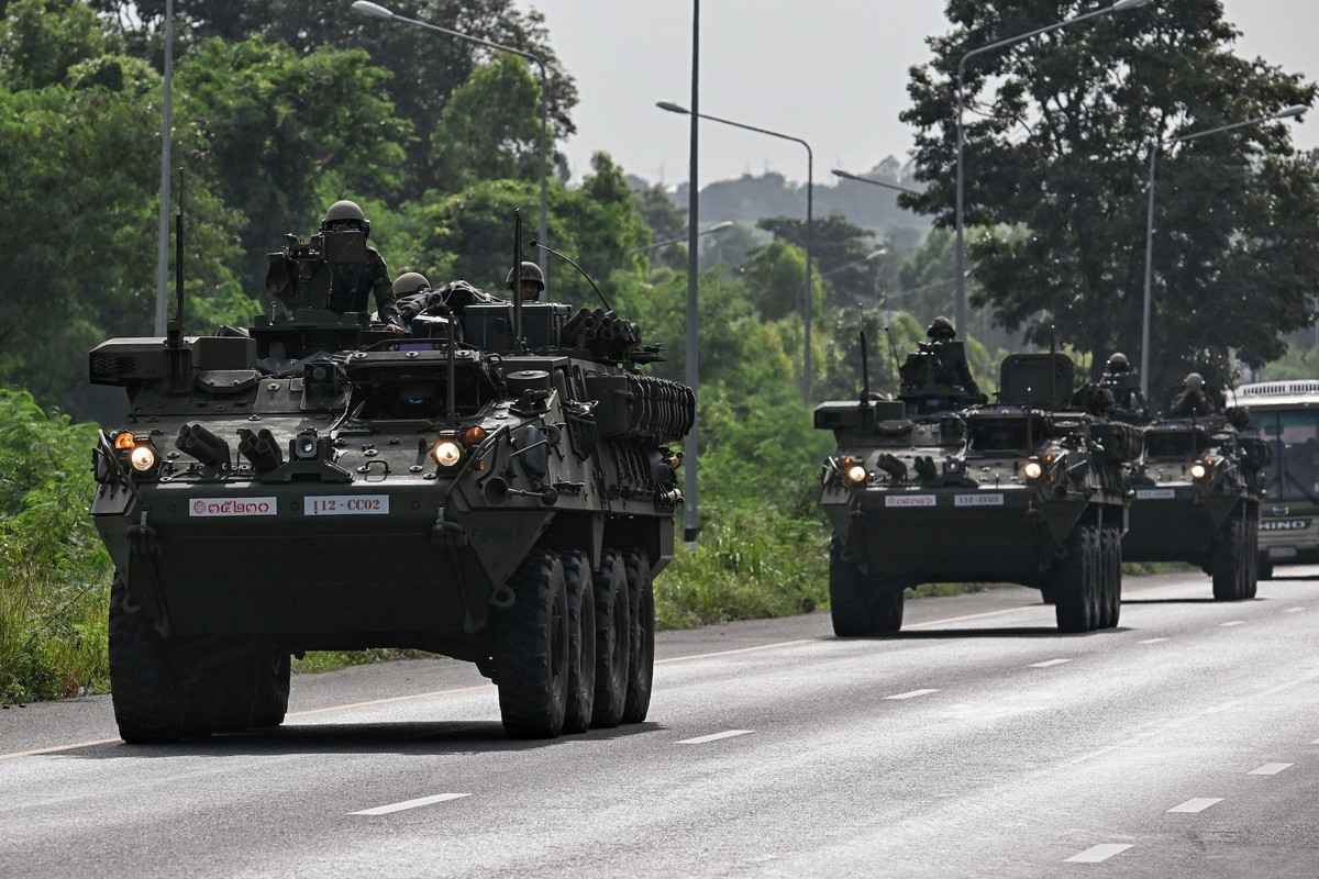 Royal Thai Army soldiers are pictured on armoured vehicles on a road in Chachoengsao province on July 24, 2025. Thailand launched air strikes on Cambodian military targets on July 24 as Cambodia fired ...