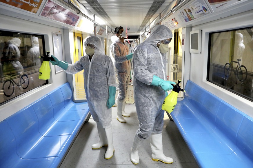 Workers disinfect subway trains against coronavirus in Tehran, Iran, in the early morning of Wednesday, Feb. 26, 2020. Iran's government said Tuesday that more than a dozen people had died nation ...