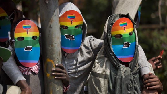 FILE - Kenyan gays and lesbians and others supporting their cause wear masks to preserve their anonymity as they stage a rare protest against Uganda&#039;s tough stance against homosexuality and in so ...