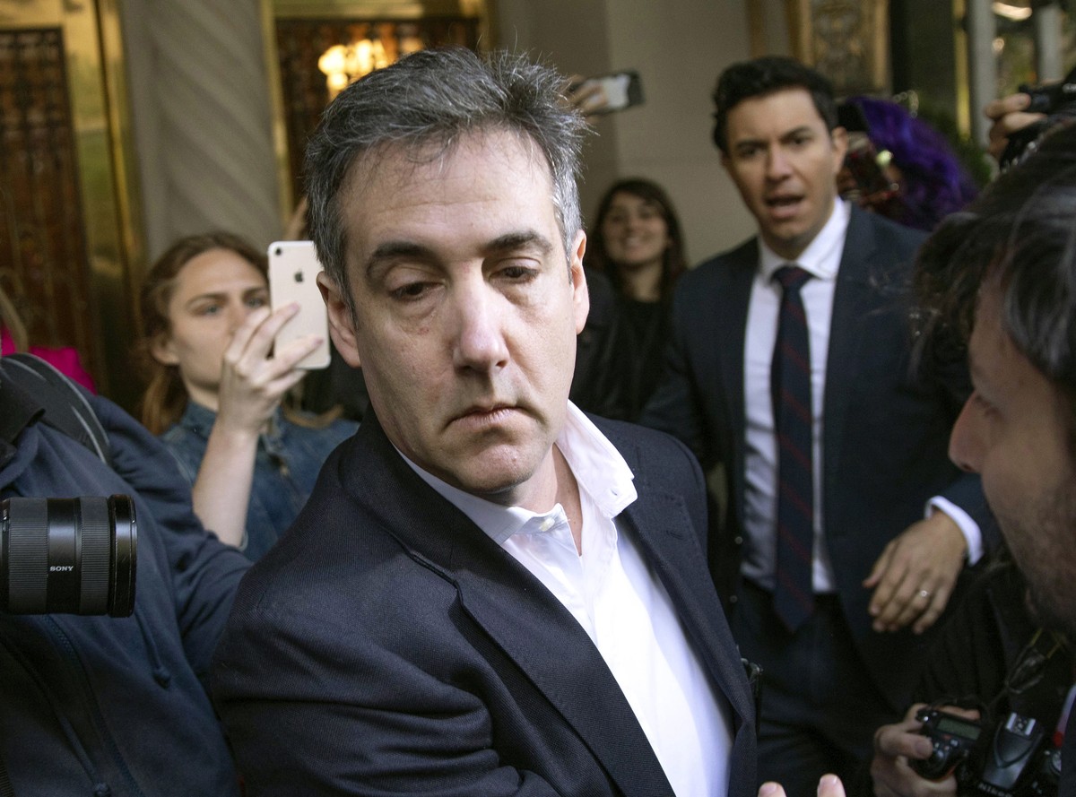 FILE - In this May 6, 2019, file photo, Michael Cohen, former attorney to President Donald Trump, leaves his apartment building before beginning his prison term in New York. Cohen pleaded guilty to or ...