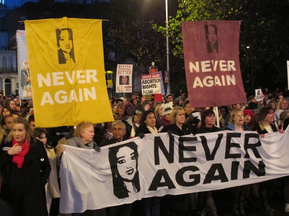 FILE - This Saturday, Nov. 17, 2012 file photo shows abortion rights protesters holding pictures of Savita Halappanavar as they march through central Dublin, demanding that Ireland&#039;s government e ...