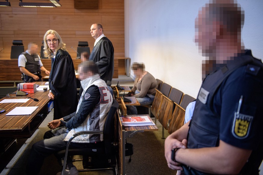 epa06799928 Defendants Christian L. (C) and Berrin T. (R) wait with ther lawyers Martina Naegele and Matthias Wagner for the beginning of their trial on charges related to sexual abuse of a minor at t ...