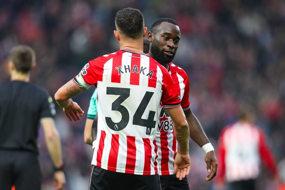 Sunderland v Wolverhampton Wanderers, Premier League Granit Xhaka Of Sunderland celebrates winning with Lutsharel Geertruida Of Sunderland during the Sunderland v Wolverhampton Wanderers Premier Leagu ...