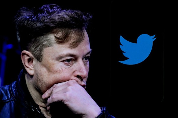 ANKARA, TURKIYE - OCTOBER 06: In this photo illustration, the image of Elon Musk is displayed on a computer screen and the logo of twitter on a mobile phone in Ankara, Turkiye on October 06, 2022. Muh ...