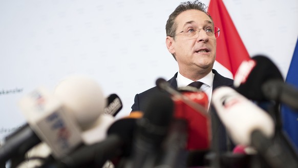 Austrian Vice Chancellor Heinz-Christian Strache (Austrian Freedom Party), center, addresses the media during press conference at the sport ministry in Vienna, Austria, Saturday, May 18, 2019. Strache ...
