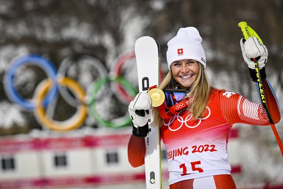 epa09757667 Gold medalist Corinne Suter of Switzerland celebrates during the victory ceremony of the women's downhill race at the Beijing 2022 Olympic Games at the Yanqing National Alpine Ski Cen ...