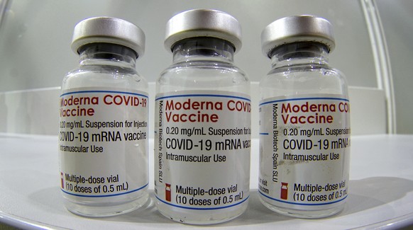 FILE - In this file photo dated Wednesday, Feb. 17, 2021, three vials of the Moderna COVID-19 Vaccine are pictured in a new coronavirus vaccination center at the &#039;Velodrom&#039; (velodrome-stadiu ...