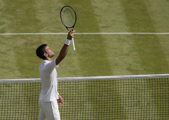 Serbia&#039;s Novak Djokovic celebrates defeating Spain&#039;s Roberto Bautista Agut during a men&#039;s singles semifinal match on day eleven of the Wimbledon Tennis Championships in London, Friday,  ...