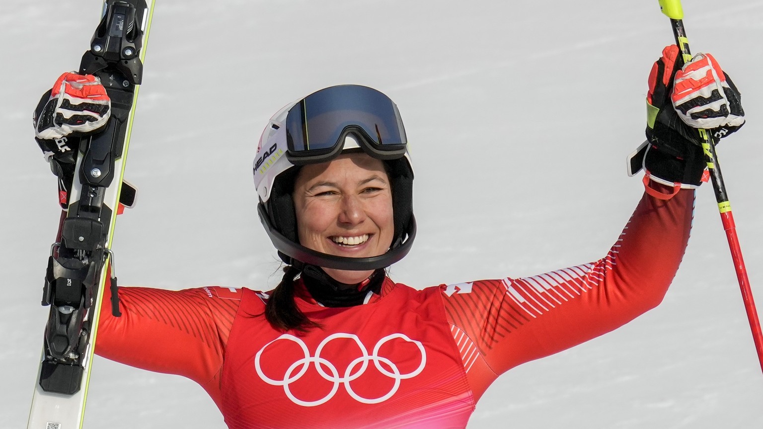 Wendy Holdener, of Switzerland, celebrates winning the bronze medal in the women&#039;s slalom at the 2022 Winter Olympics, Wednesday, Feb. 9, 2022, in the Yanqing district of Beijing. (AP Photo/Luca  ...