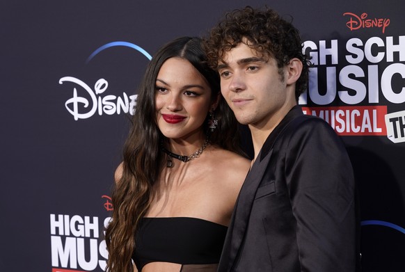 Olivia Rodrigo, left, and Joshua Bassett, cast members "High School Musical: The Musical: The Series," pose together during the season three premiere of the Disney+ streaming series Wednesday…