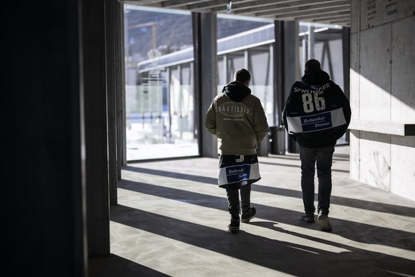 Fans roam the zondacrypto stadium prior the game between HC Fribourg-Gotteron of Switzerland and IFK Helsinki of Finland at the 97th Spengler Cup ice hockey tournament in Davos, Switzerland, on Sunday ...