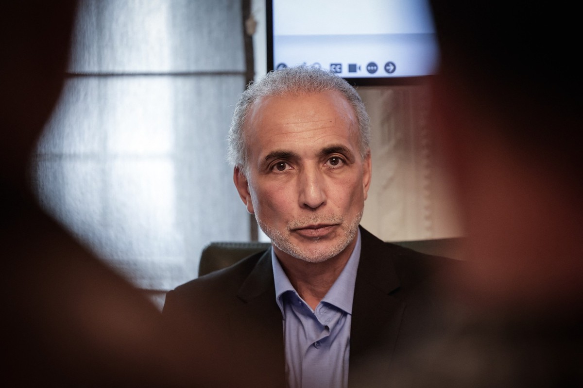 (FILES) Swiss Islamic scholar Tariq Ramadan speaks during a press conference with his lawyers to announced they intend to take new legal actions in Switzerland, where Ramadan was sentenced to three ye ...