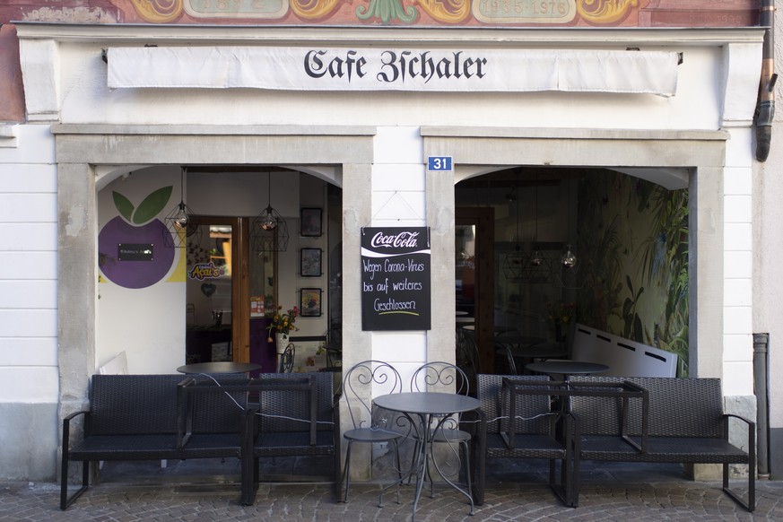 epa08298698 A closed cafe, in Chur, Switzerland, 16 March 2020. The local government of Grisons has decided to take further measures because of the Covid-19 coronavirus. Shops and restaurants must be  ...