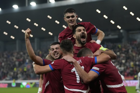 Serbia&#039;s players celebrate after a goal during the UEFA Nations League soccer match between Serbia and Switzerland at the Dubocica Stadium in Leskovac, Serbia, Saturday, Oct. 12, 2024. (AP Photo/ ...