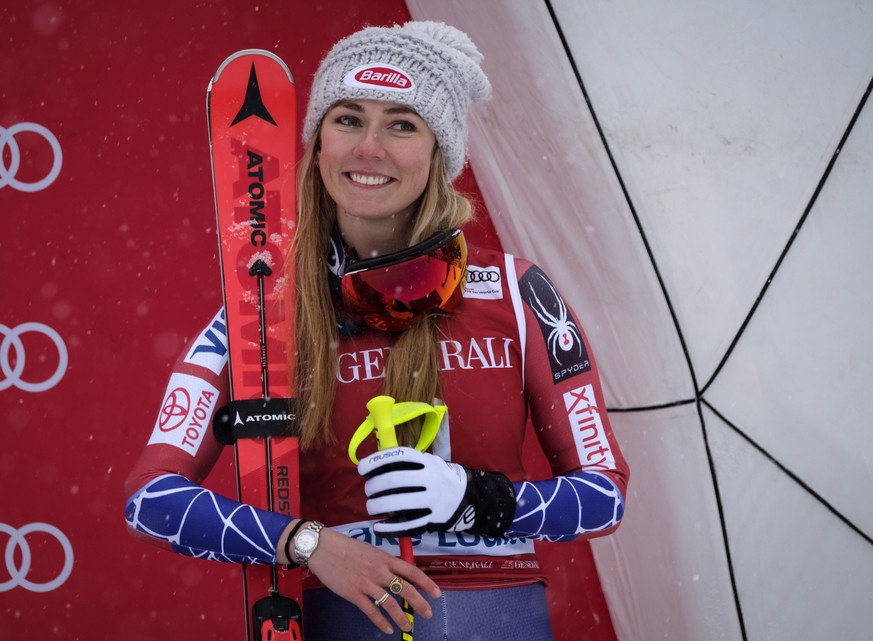 Mikaela Shiffrin, of the United States, celebrates her third place finish on the podium following the women&#039;s World Cup downhill ski race in Lake Louise, Alberta, Friday, Dec. 1, 2017. (Jeff McIn ...