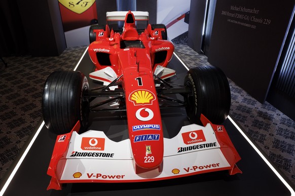 epa10285789 The Formula One Ferrari F2003 GA chassis number 229 with which Germany&#039;s F1 driver Michael Schumacher won his sixth World Championship title, is displayed during a preview at Sotheby& ...