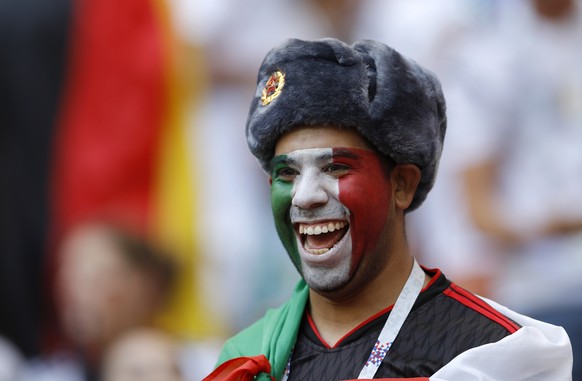 A supporter of Mexico smiles on the stands before the group F match between Germany and Mexico at the 2018 soccer World Cup in the Luzhniki Stadium in Moscow, Russia, Sunday, June 17, 2018. (AP Photo/ ...