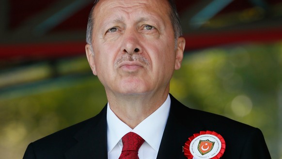 epa06986147 A handout photo made available by Turkish President Press office shows Turkish President Recep Tayyip Erdogan speaking during a graduation ceremony of Turkish Land Forces Command (NCO) voc ...