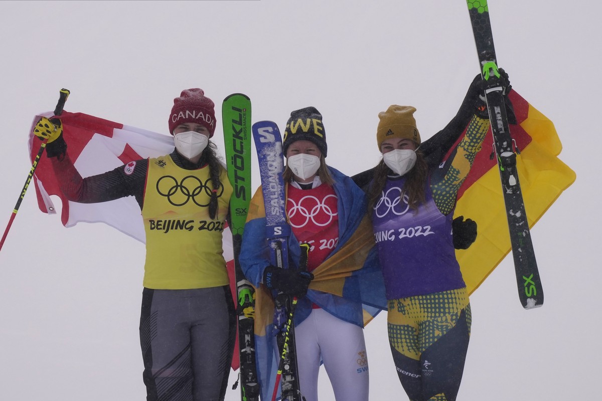 From left silver medal winner Sweden's Sandra Naeslund, gold medal winner Canada's Marielle Thompson and bronze medal winner Germany's Daniela Maier celebrate during the venue award cer ...