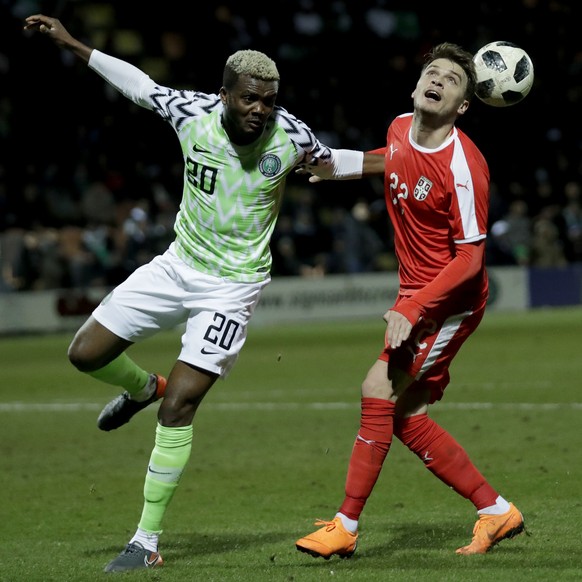 Serbia's Adem Ljajic, right, competes with Nigeria's Chidozie Awaziem during the international friendly soccer match between Serbia and Nigeria at The Hive Stadium in London, Tuesday, March ...
