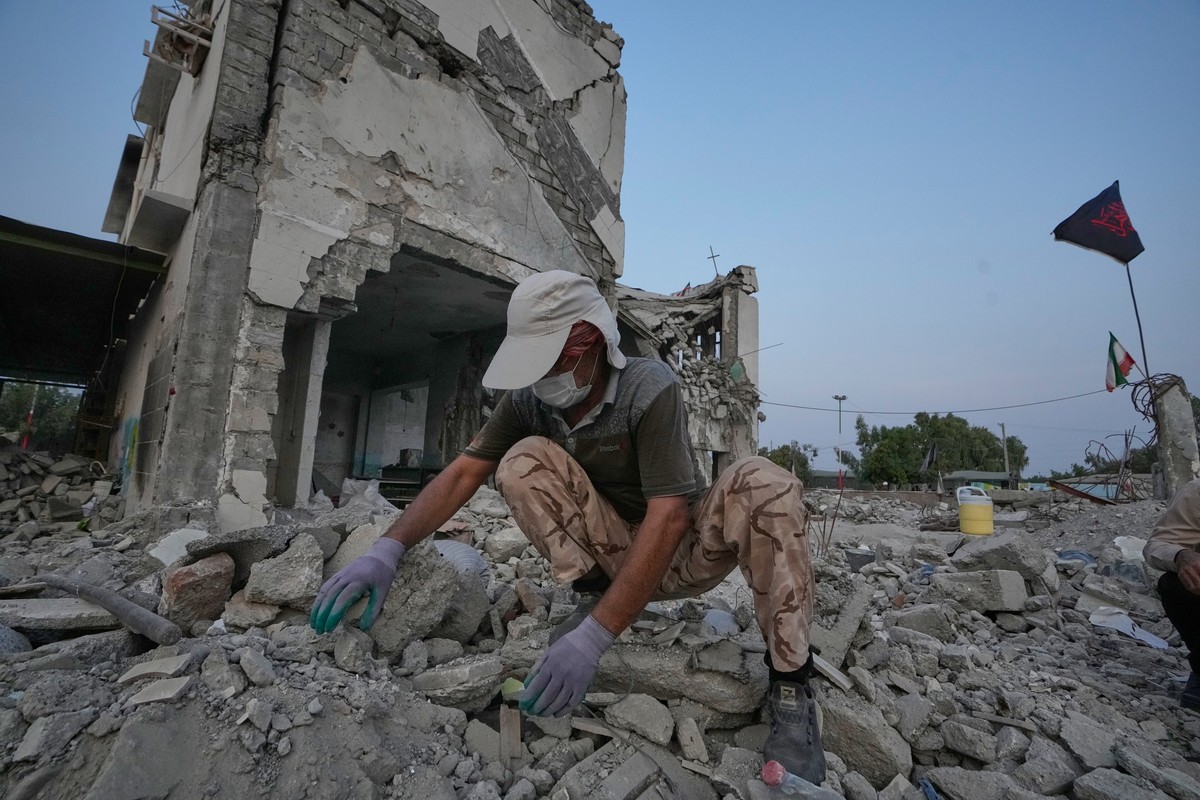 A volunteer searches through the rubble of Shajareh Tayyebeh school, shattered by a U.S. airstrike on Feb. 28, in Minab, southern Iran, Monday, Sept. 7, 2026. (AP Photo/Vahid Salemi)
Iran School