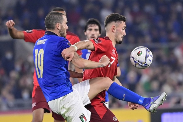 Italy&#039;s defender Leonardo Bonucci, left, fights for the ball against Switzerland&#039;s forward Andi Zeqiri, right, during the 2022 FIFA World Cup European Qualifying Group C match between Italy  ...