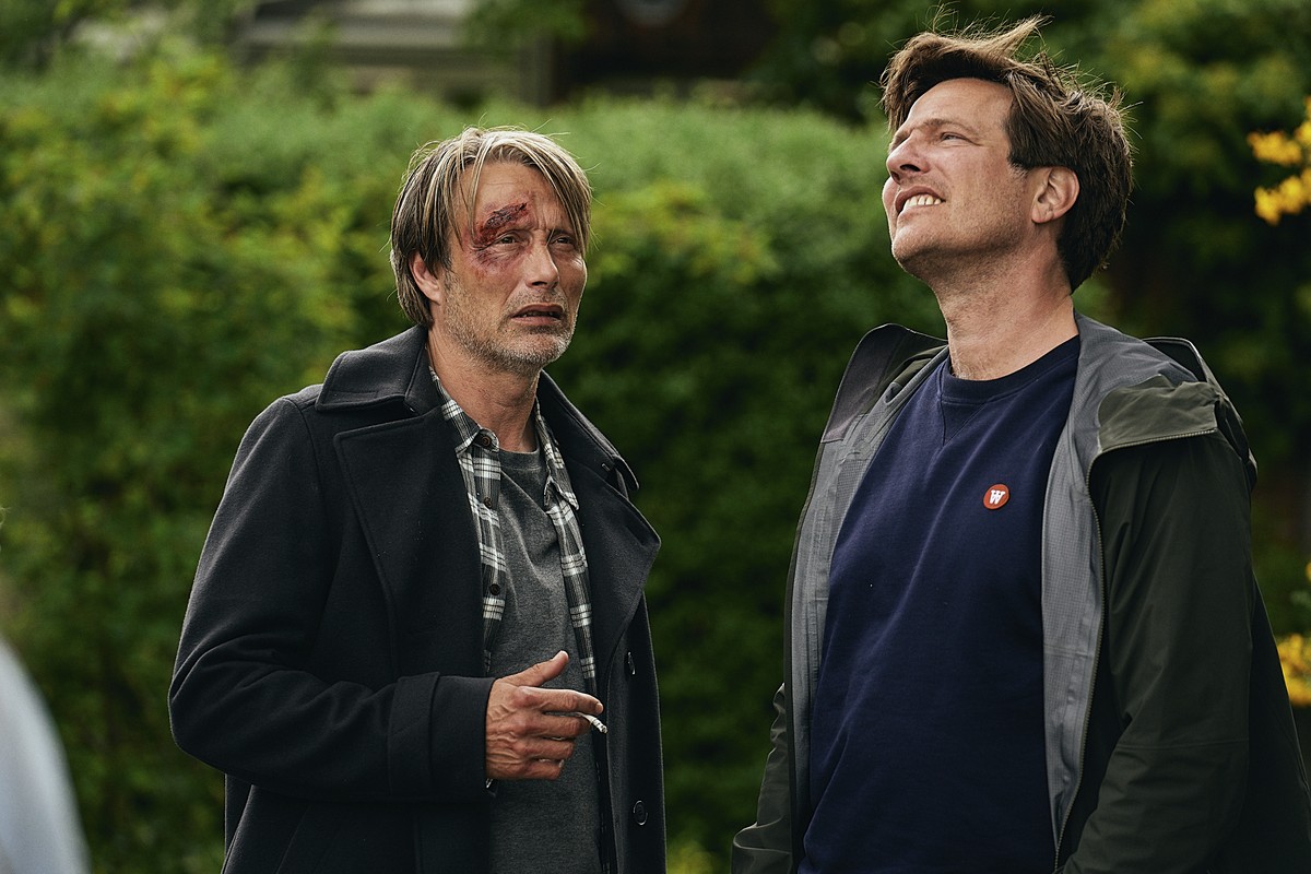 This image released by Samuel Goldwyn Films shows Mads Mikkelsen, left, with director Thomas Vinterberg on the set of "Another Round." (Samuel Goldwyn Films via AP)