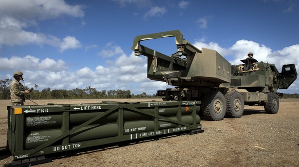FILE - In this image provided by the U.S. Army, U.S. Army Sgt. Ian Ketterling, gunner for Alpha Battery, 1st Battalion, 3rd Field Artillery Regiment, 17th Field Artillery Brigade, prepares the crane f ...