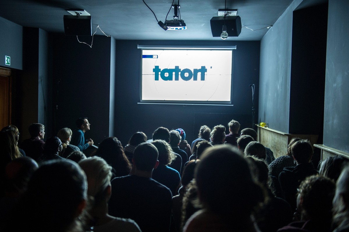 epa05191265 A picture dated 28 February 2016 shows the lettering 'Tatort' on the big screen at the Comedy Cafe Berlin, in Berlin, Germany. At the Berlin-Neukoelln pub, guests can now watch a ...