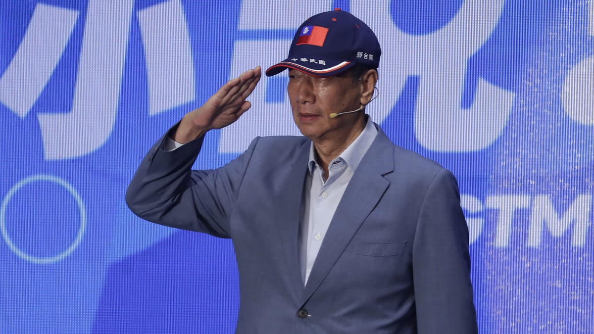 Chief Executive Officer of Hon Hai Precision Industry (Foxconn) Terry Gou salutes during a media event in Taipei, Taiwan, Sunday, April 30, 2023. (AP Photo/ Chiang Ying-ying)