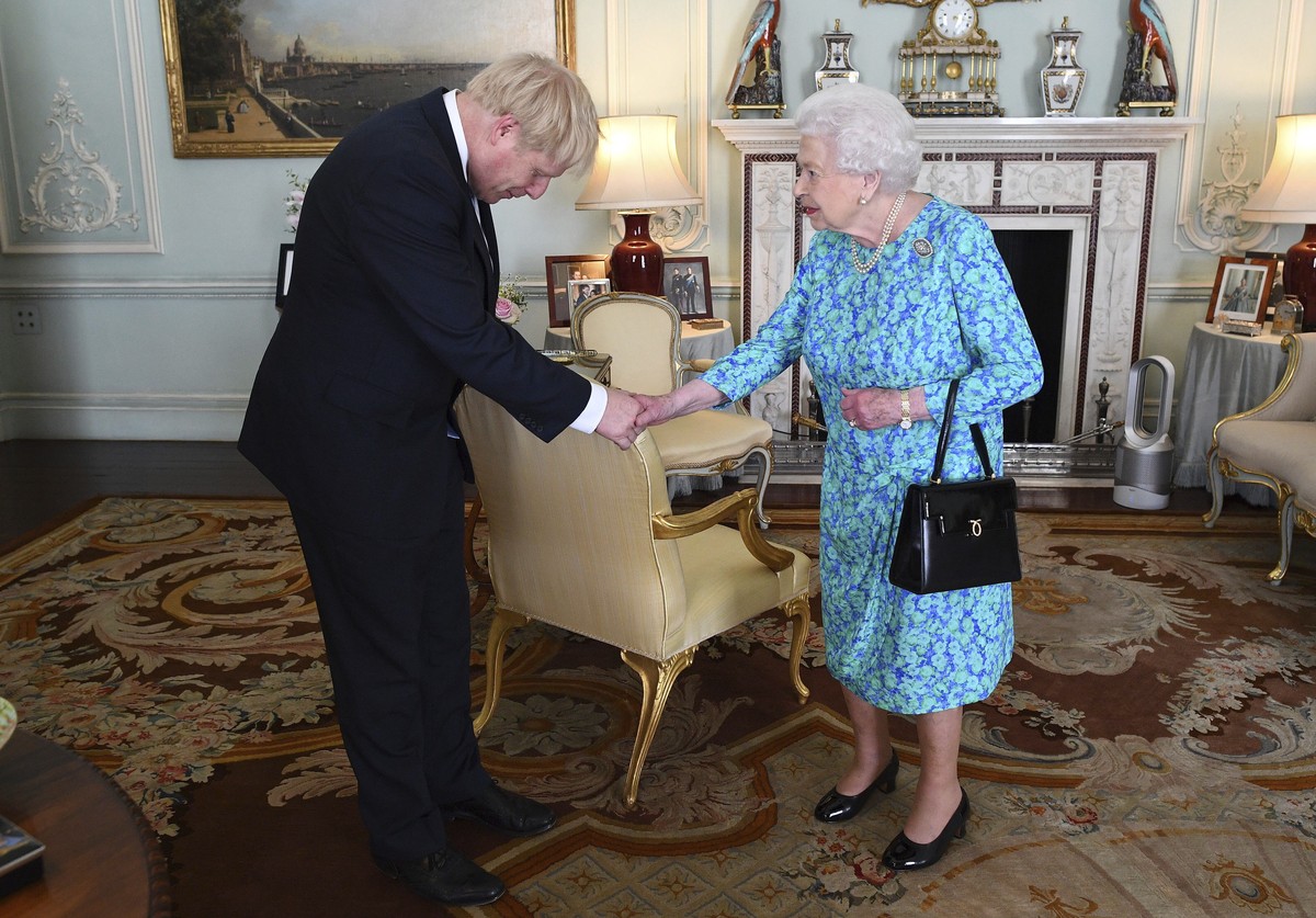 Britain's Queen Elizabeth II welcomes newly elected leader of the Conservative party Boris Johnson during an audience at Buckingham Palace, London, Wednesday July 24, 2019, where she invited him  ...