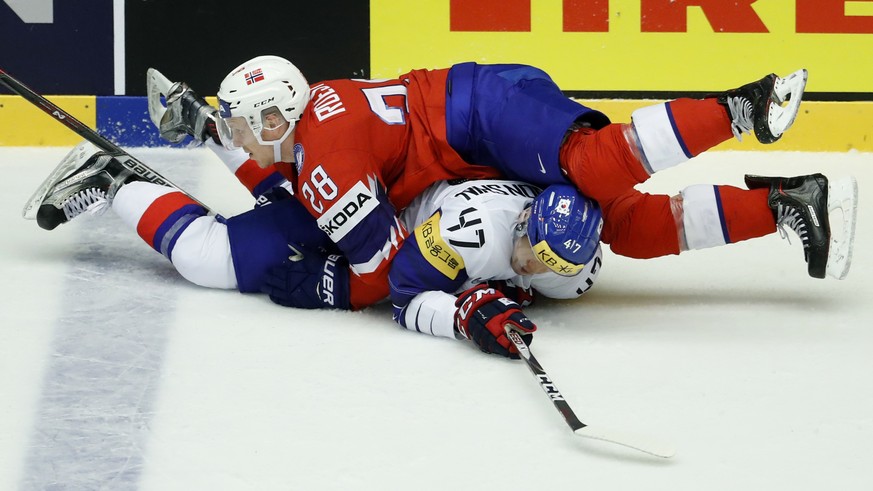 Norway&#039;s Niklas Roest, up, collides with South Korea&#039;s Shin Sanghoon, down, during the Ice Hockey World Championships group B match between South Korea and Norway at the Jyske Bank Boxen are ...