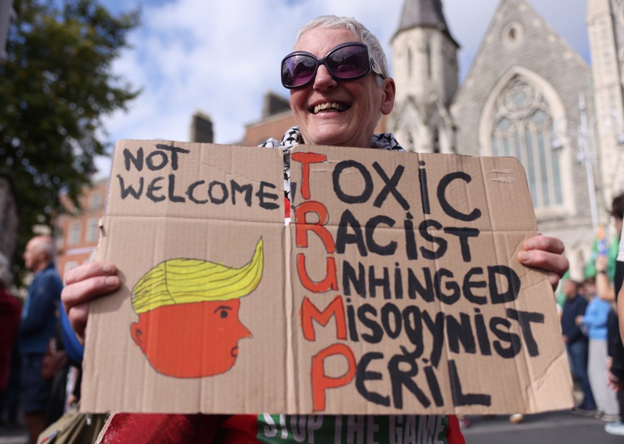 epa13234172 Balloons are flown by anti-Trump demonstrators during a protest march against US President Donald Trump, in Dublin, Ireland, 12 September 2026. The US president is on a two-day visit to Ir ...