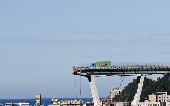 A view of the Morandi highway bridge that collapsed in Genoa, northern Italy, Wednesday, Aug. 15, 2018. A large section of the bridge collapsed over an industrial area in the Italian city of Genova du ...
