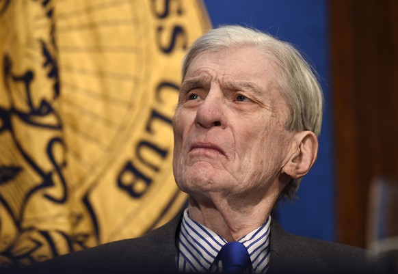 Former Virginia Sen. John Warner, also a former Navy secretary, listens as Chief of Naval Operations Adm. John Richardson speaks at the National Press Club in Washington, Monday, Jan. 11, 2016, discus ...