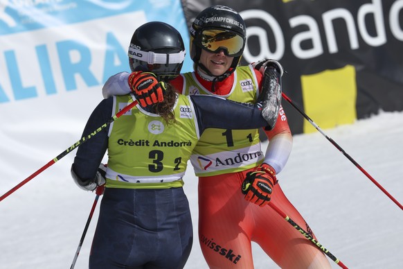 Switzerland&#039;s Andrea Ellenberger, right, hugs Norway&#039;s Maria Therese Tviberg during an alpine ski, mixed team World Cup event in Soldeu, Andorra, Friday, March 17, 2023. (AP Photo/Alessandro ...