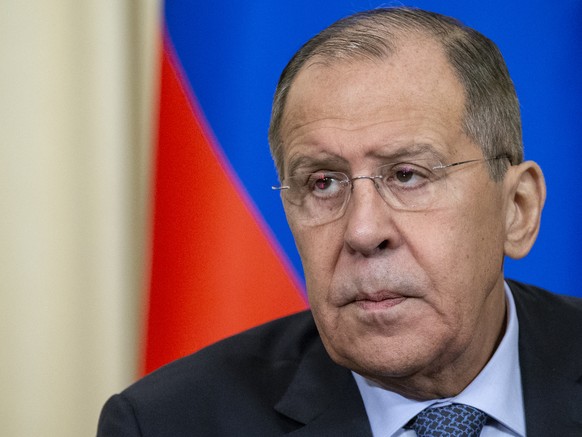 Russian Foreign Minister Sergey Lavrov listens for a journalist&#039;s question during a joint news conference with his Dominican Republic counterpart Miguel Vargas following their talks in Moscow, Ru ...