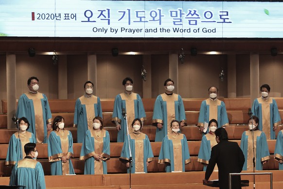 Members of the choir wear face masks as they attend Mass at the Yoido Full Gospel Church in Seoul, South Korea, Sunday, March 1, 2020. The church decided to replace Sunday services with online ones for members' safety amid the spread of the COVID-19. (AP Photo/Ahn Young-joon)
