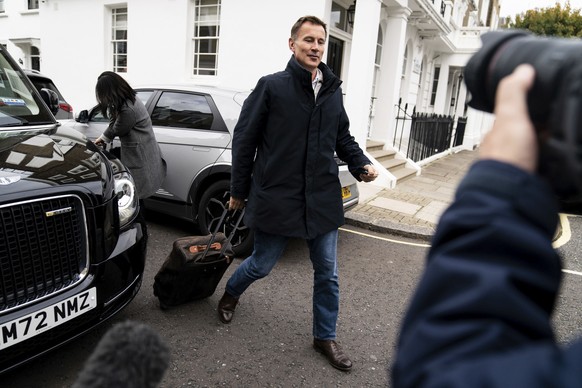 Jeremy Hunt arrives at his home in London after he was appointed Chancellor of the Exchequer following the resignation of Kwasi Kwarteng, Friday Oct. 14, 2022. Chancellor of the Exchequer Kwasi Kwarte ...