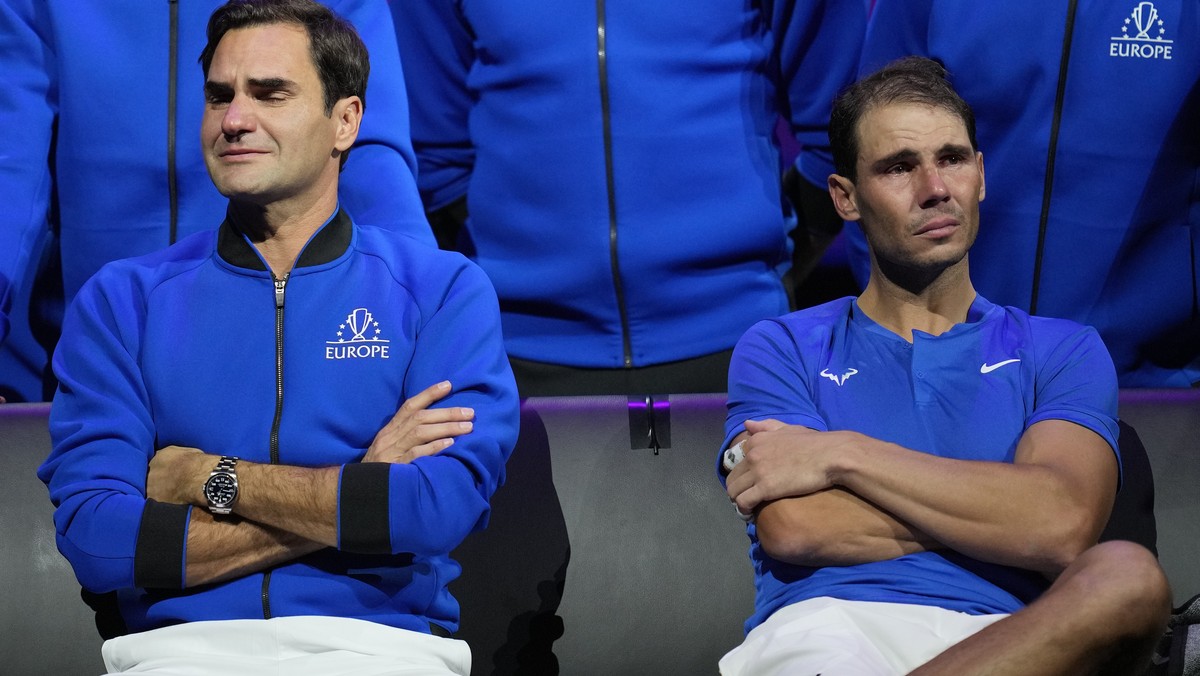 An emotional Roger Federer, left, of Team Europe sits alongside his playing partner Rafael Nadal after their Laver Cup doubles match against Team World's Jack Sock and Frances Tiafoe at the O2 ar ...