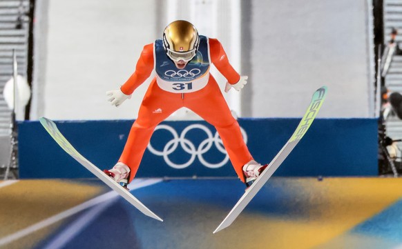 epa12722105 Gregor Deschwanden of Switzerland in action during the Men's Normal Hill of the Ski Jumping competitions at the Milano Cortina 2026 Winter Olympic Games, in Predazzo, Italy, 09 Februa ...