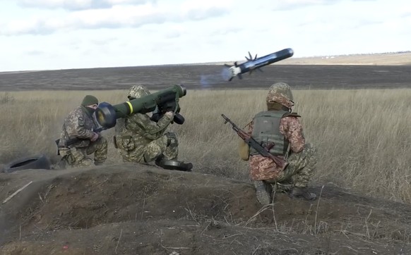 FILE - In this image taken from footage provided by the Ukrainian Defense Ministry Press Service, a Ukrainian soldiers use a launcher with US Javelin missiles during military exercises in Donetsk regi ...