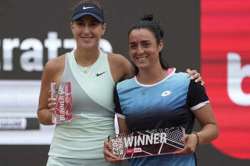 Ons Jabeur from Tunesia, right, poses with Belinda Bencic from Switzerland after winning the final tennis match of the WTA tournament in Berlin, Germany, Sunday, June 19, 2022. (AP Photo/Michael Sohn)
