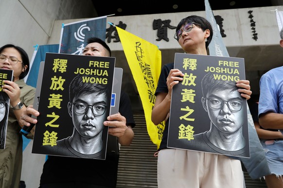 Hong Kong activist and supporters hold signs during a press event to support pro-democracy activist Joshua Wong in Taipei, Taiwan, Wednesday, Sept. 2, 2026. (AP Photo/Chiang Ying-ying)
Taiwan Hong Kon ...