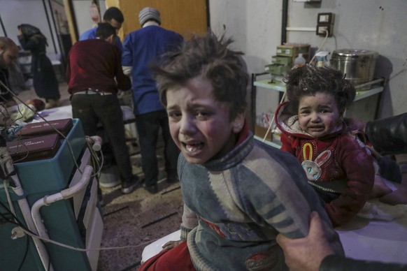 epaselect epa06544187 Injured children are treated at a hospital in rebel-held Douma, Eastern Ghouta, Syria, 19 February 2018. At least 85 people were killed in heavy bombing by forces allegedly loyal ...