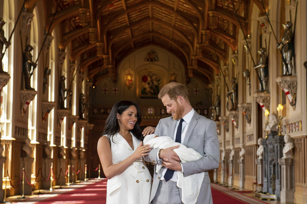 Britain's Prince Harry and Meghan, Duchess of Sussex, during a photocall with their newborn son, in St George's Hall at Windsor Castle, Windsor, south England, Wednesday May 8, 2019. Baby Su ...