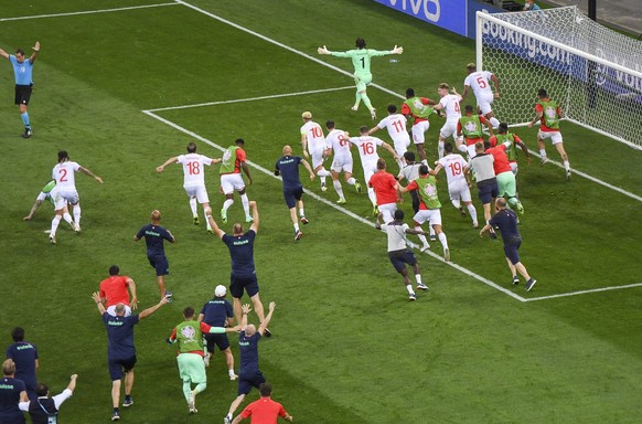 Swiss players celebrate after defeating France 5-4 in a penalty shoot out during the Euro 2020 soccer championship round of 16 match at National Arena stadium, Bucharest, Romania, Tuesday, June 29, 20 ...