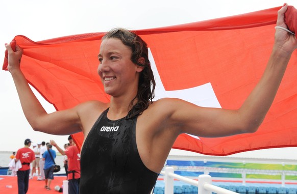 SHANGHAI, July 22, 2011 -- Swann Oberson of Switzerland celebrates after winning the women s 5km open water event at the 14th FINA World Championships in Shanghai, July 22, 2011. Swann Oberson claimed ...