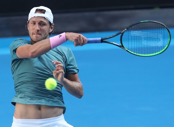 epa07305210 Lucas Pouille of France in action against Borna Coric of Croatia during day eight of the Australian Open tennis tournament in Melbourne, Australia, 21 January 2019. EPA/DAVID CROSLING AUST ...