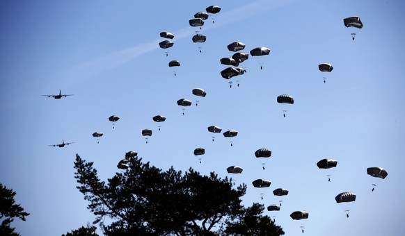FILE - Paratroopers take part in an exercise of the U.S. Army Global Response Force in Hohenfels, Germany, Wednesday, Aug. 26, 2015. Finland and Sweden are nearing decisions on whether to ditch their ...